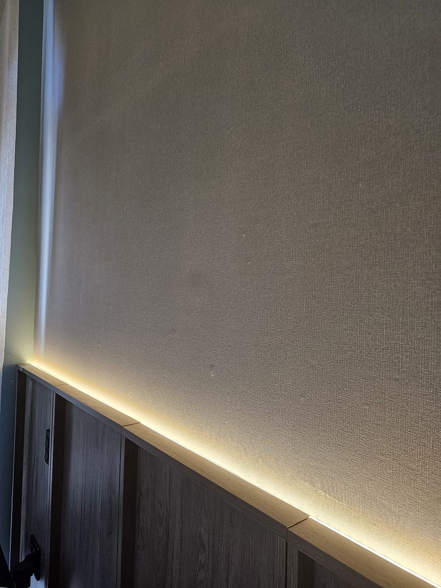 Alternate angle of concealed LED lighting above a timber bedhead at Bimbadgen — The Lane Retreat
